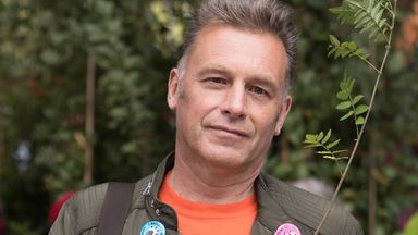 Television presenter and environmentalist Chris Packham holds a plant as he joins Extinction Rebellion and anti-HS2 protesters as they demonstrate outside the High Speed 2 headquarters at Euston Station in London, Britain September 28, 2019. REUTERS/Simon Dawson